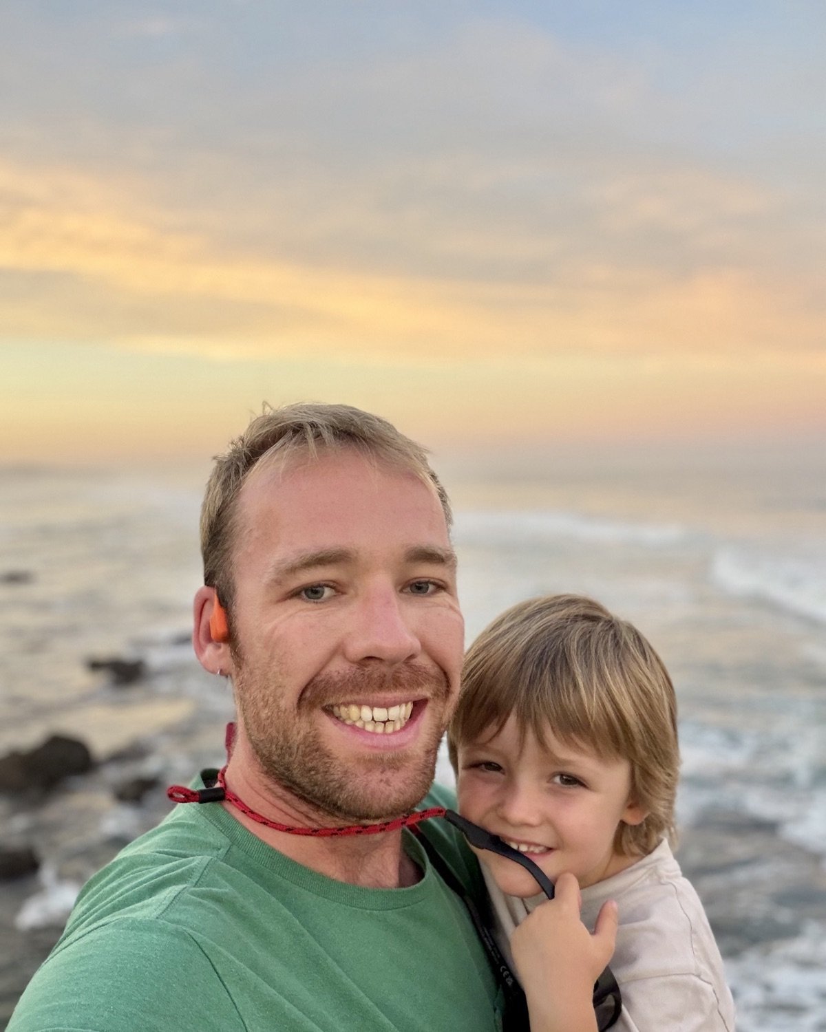 Simon, founder of Hello Giulia, with his son at the coast